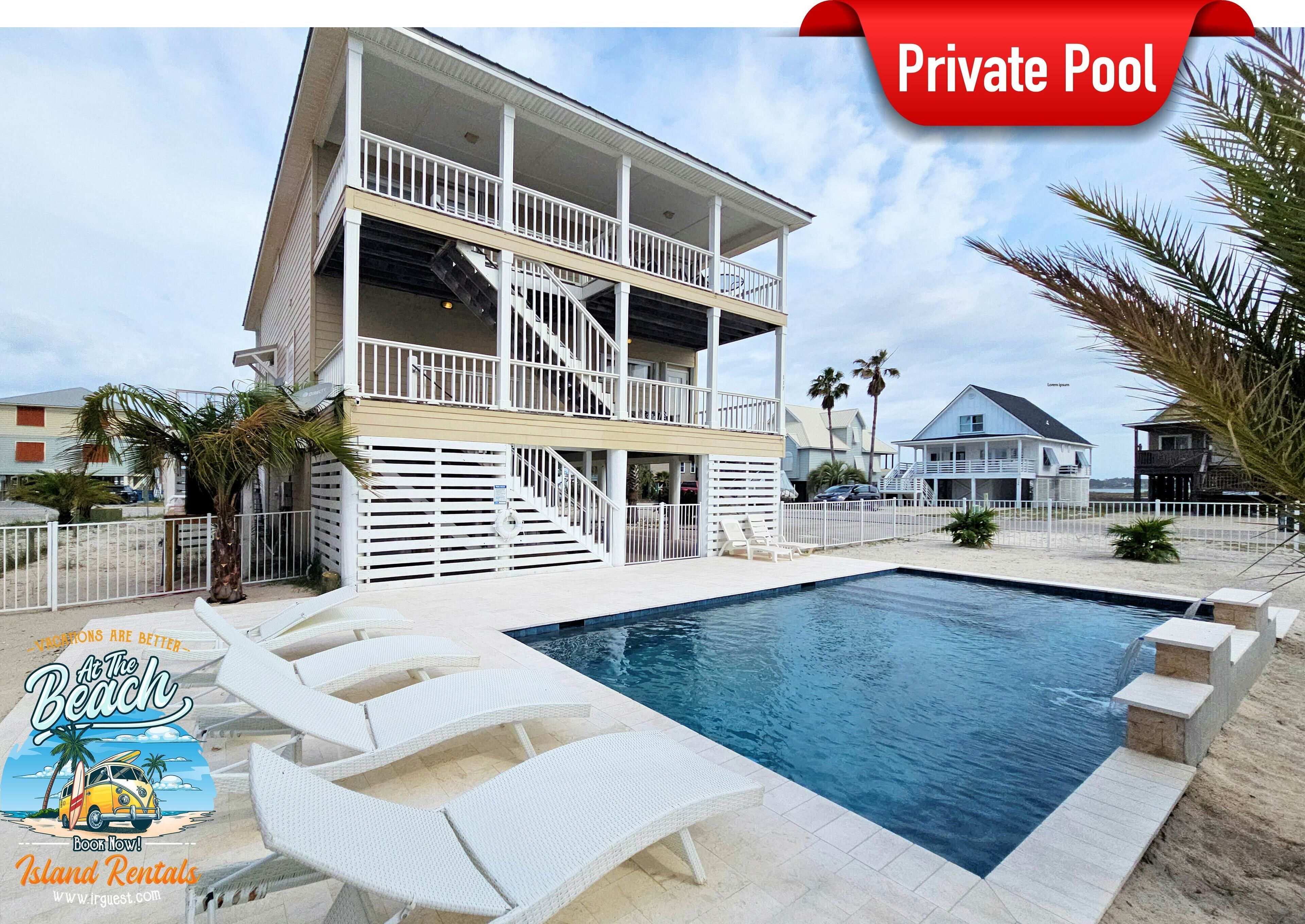 A two-story house with a private pool, white railings, and a beach view.
