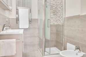 Shower, hair dryer, bidet, toilet paper