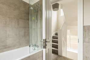 Combined shower/tub, hair dryer, towels, soap