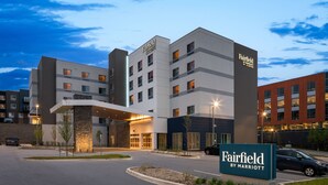 A Marriott Fairfield hotel with a modern design, featuring a prominent entrance and multiple floors.