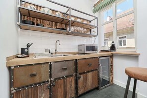 Fridge, microwave, stovetop, coffee/tea maker