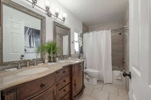 Bathtub, hair dryer, towels