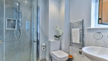 Bathtub, hair dryer, towels, soap