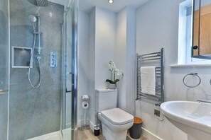 Bathtub, hair dryer, towels, soap