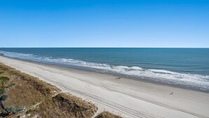 A wide beach with a clear sky. - Beach Cove Resort 1202 - 2 Bed/2Bath Ocean Front Condo (North Myrtle Beach)