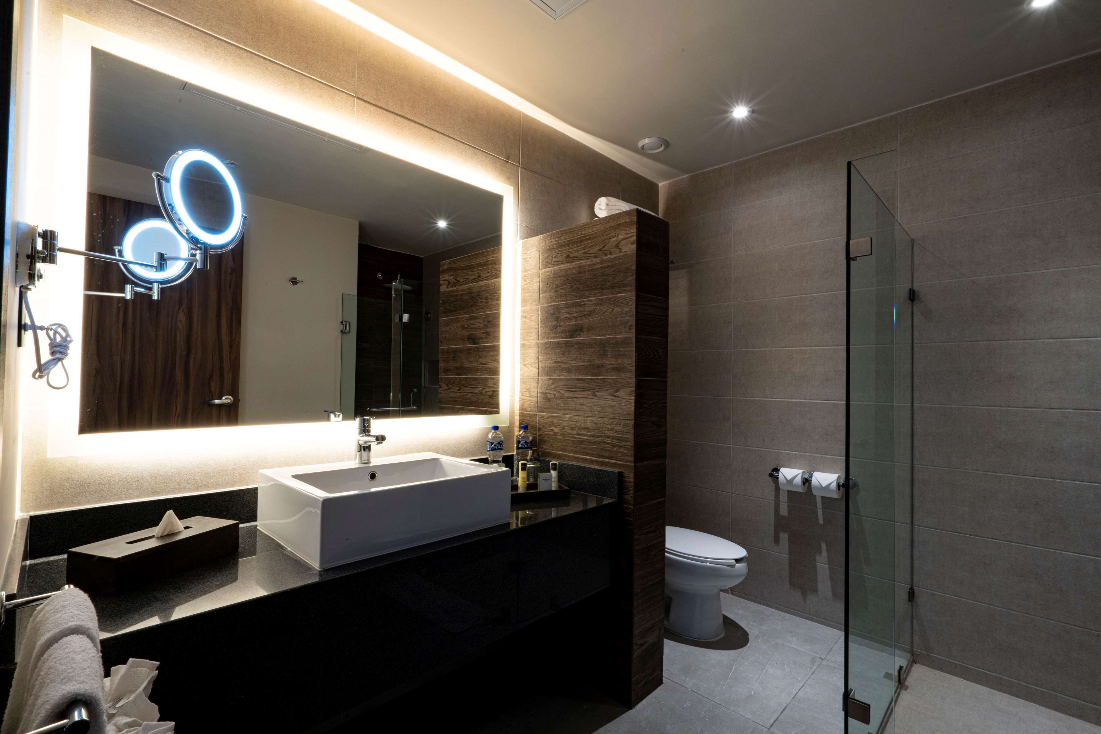 shower, rainfall showerhead, hair dryer, towels