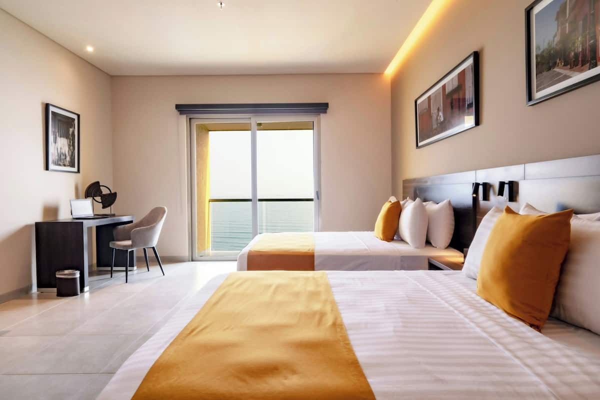 Standard Room, 2 Queen Beds, Ocean View | Minibar, in-room safe, individually decorated, desk