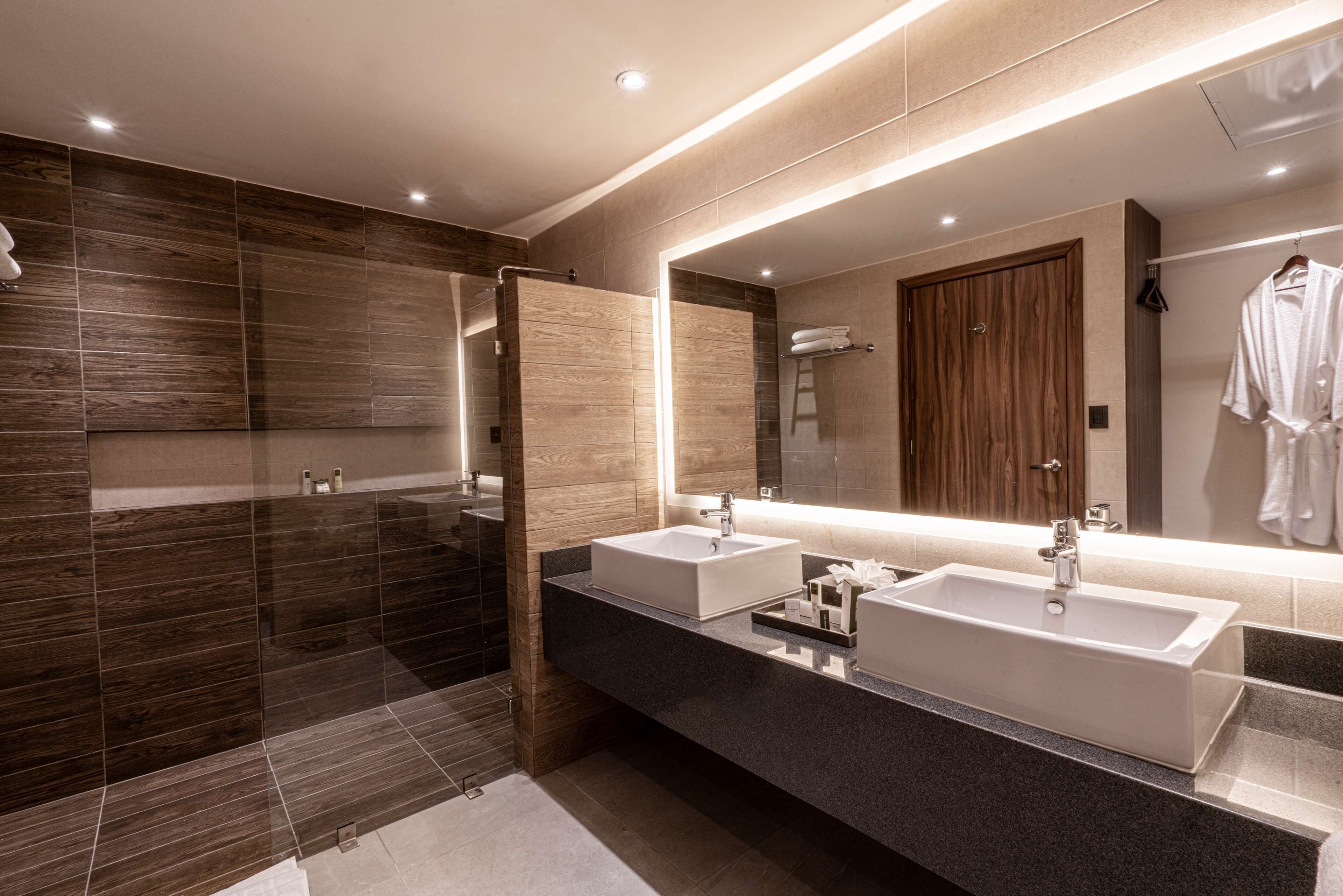 shower, rainfall showerhead, hair dryer, towels