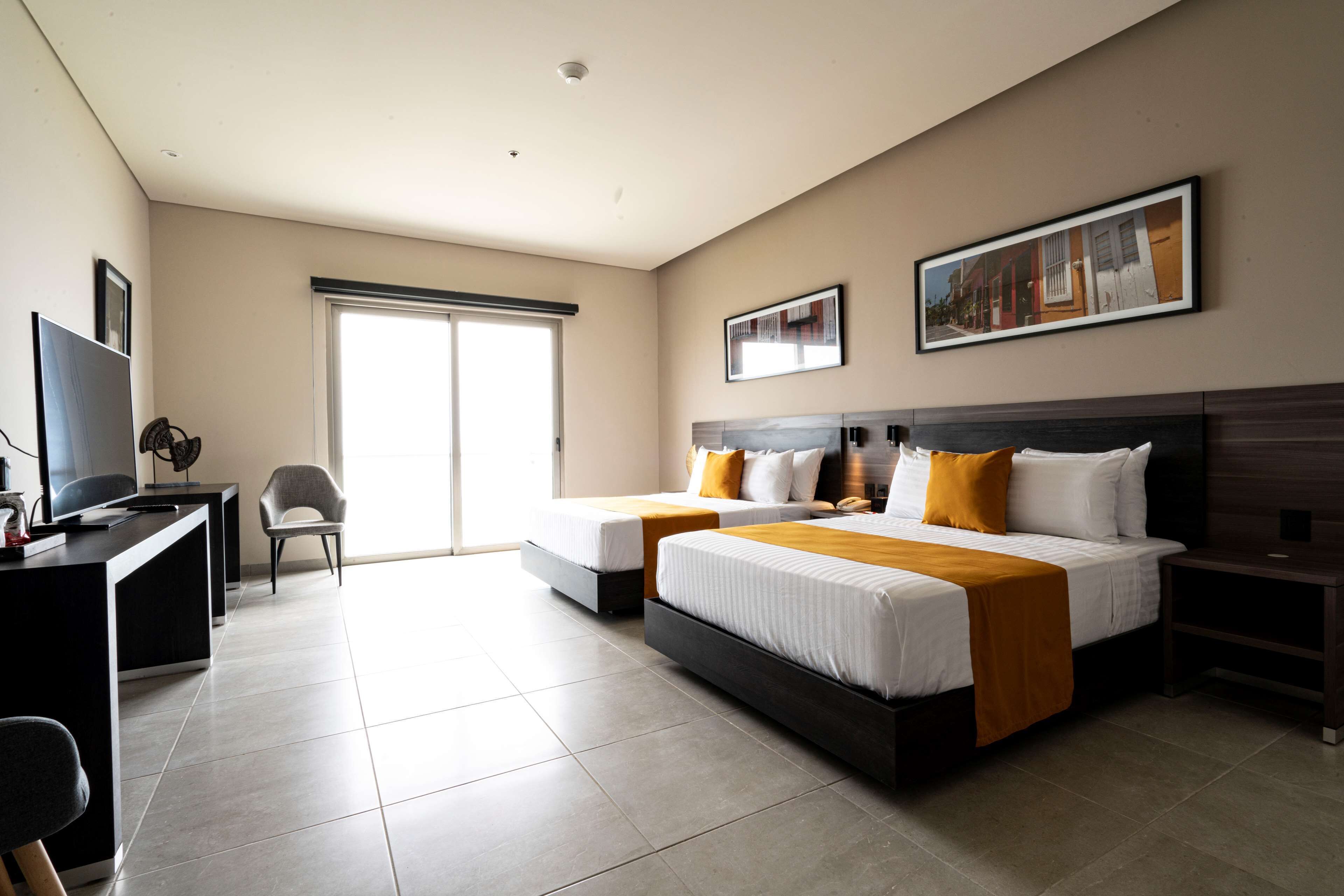 standard room, 2 queen beds, non smoking, ocean view | minibar, in-room safe, individually decorated, desk