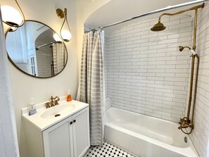 Combined shower/bathtub, hair dryer, towels, soap