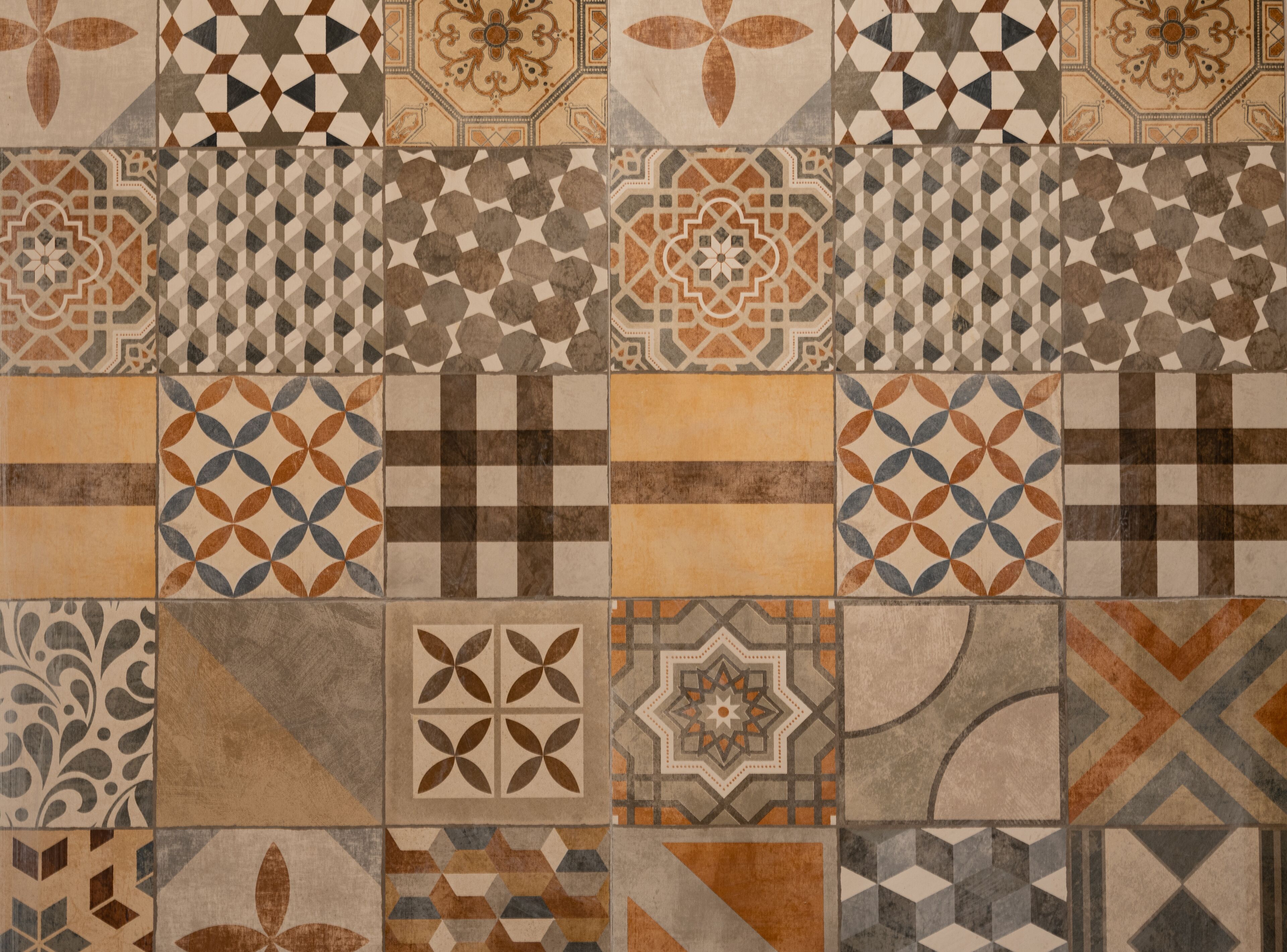 A variety of tile patterns and designs, likely part of a building's interior decoration.
