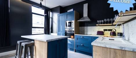 Departamento Deluxe, baño privado | Cocina compartida