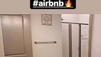 Bathtub, hair dryer, towels, soap