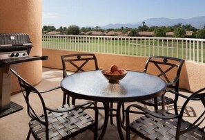 Enjoy al fresco dining on the balcony with a grill and seating for four.
