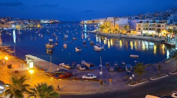 Stroll along the marina, surrounded by boats and picturesque views.