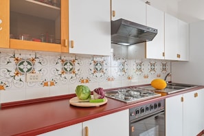 Private kitchen - GuestHost - Comfortable 50 sqm apartment with terrace, able to accommodate up to 4 people, located on the fifth floor of a building with lift (NOT suitable for disabled people - 15 steps to access it). The property is located in a quiet area of Tao (Taormina)