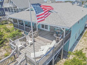 Terrace/patio - Experience oceanfront luxury at Salty Paradise, a spacious 4-bedroom home in Holden Beach. (Holden Beach)