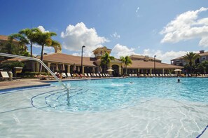 A swimming pool with lounge chairs and palm trees. - Luxurious 3BD Home Close to Convention Center and Themed Parks! #3vc209 (Orlando)