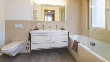 Combined shower/tub, hair dryer, towels, soap