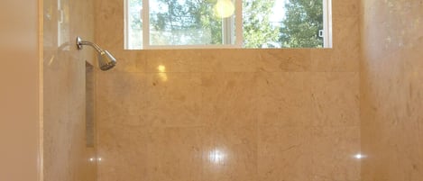 Combined shower/bathtub, hair dryer, towels, soap