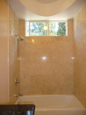 Combined shower/bathtub, hair dryer, towels, soap