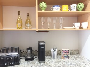 Fridge, microwave, coffee/tea maker, toaster
