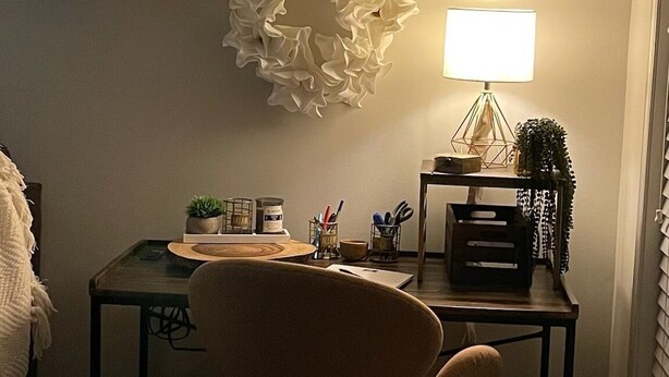 A room with a desk, a chair, a lamp, and decorative wall art. - Townhome:  2 Bedrooms, 2.5 Baths, Close to Campus (Oxford)