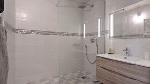 Shower, hair dryer, towels, toilet paper