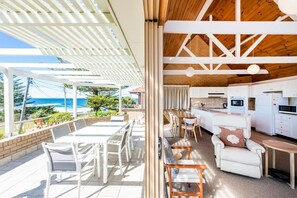 Outdoor dining - Location+++ Ocean & headland views. Wifi, gifts, linen, 3 bed, 2 bath & parking! (Yamba)