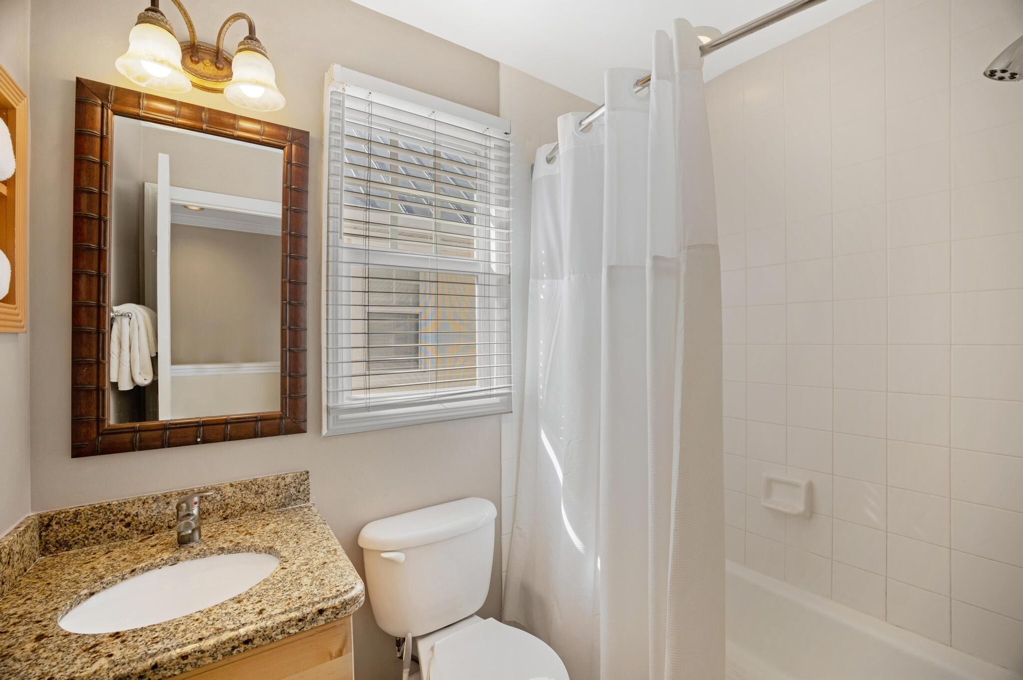 Combined shower/tub, hair dryer, towels, soap