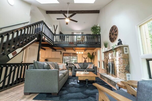 TV, fireplace - Lakeview Chalet w/ Hot Tub, Sauna, Decks, Boats, & Fire Pit! (East Stroudsburg)