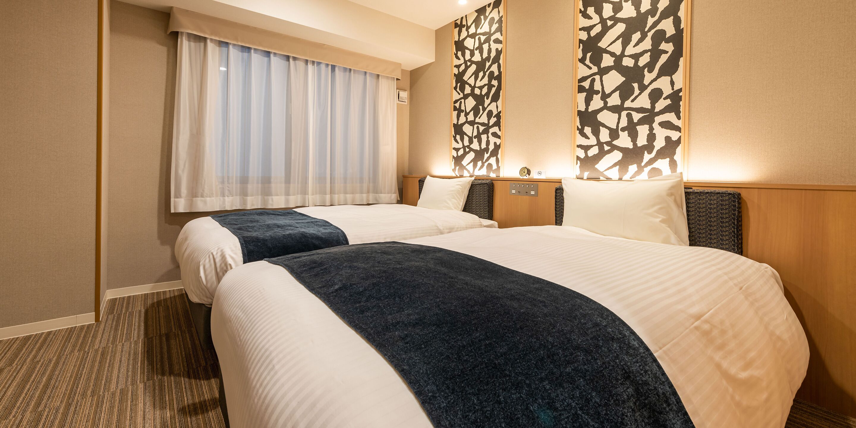 economy twin room, non smoking | 1 bedroom, down duvets, in-room safe, blackout curtains