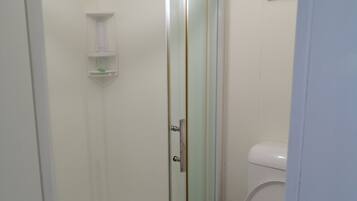 Shower, towels, soap, toilet paper