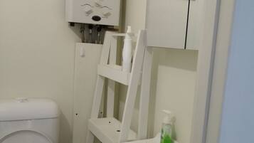 Shower, towels, soap, toilet paper