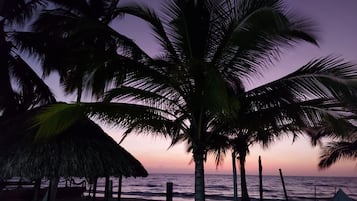 On the beach, sun-loungers