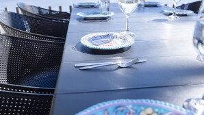 A table set with plates, cutlery, and a glass of water.