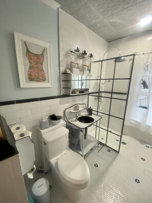 Shower, hair dryer, towels, soap