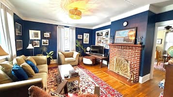 Smart TV, fireplace, books, printers