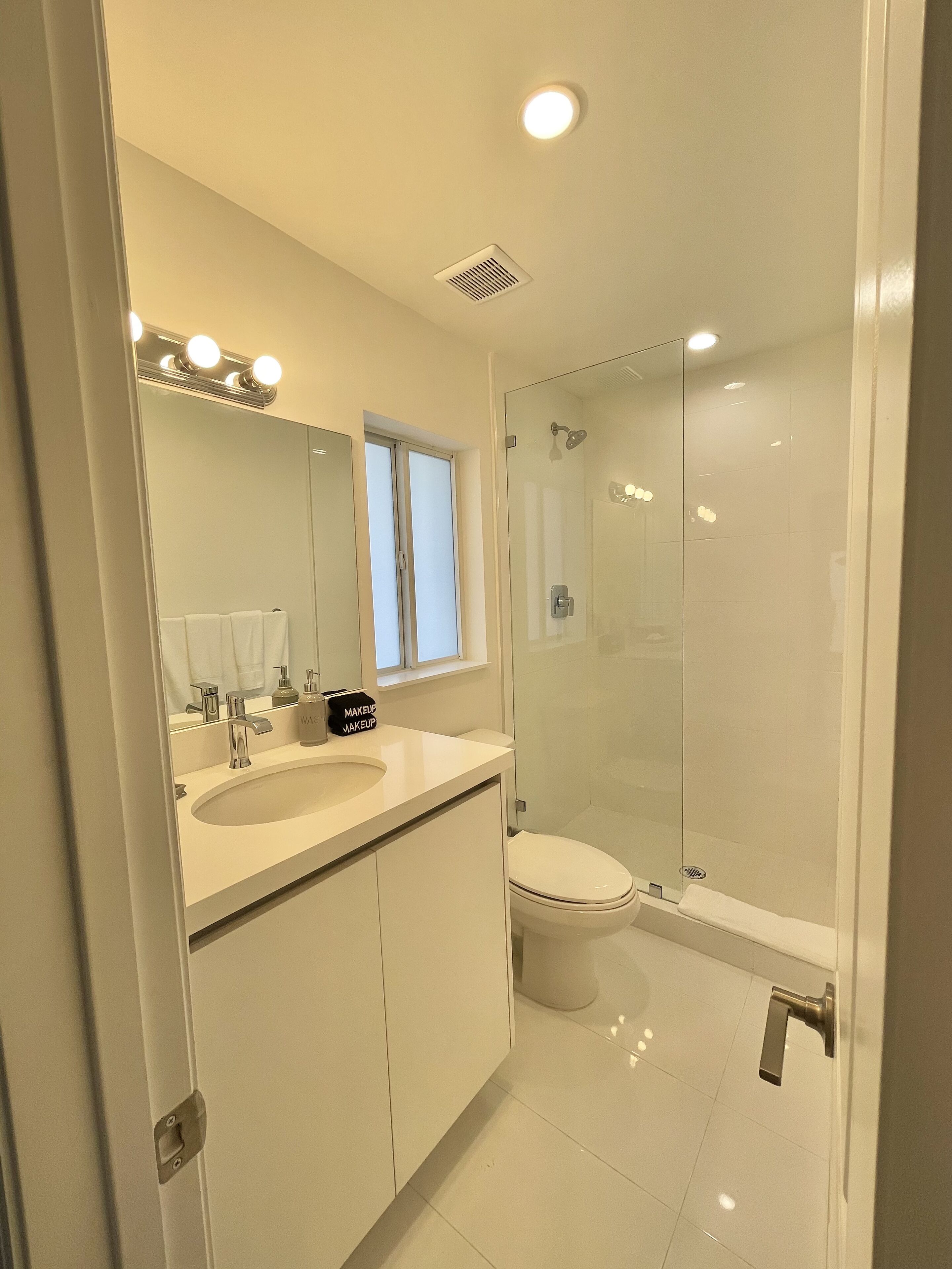 Shower, hair dryer, towels, soap