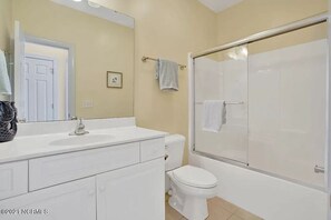 Bathtub, hair dryer, towels, soap
