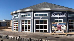 A blue building with a sign reading "CAROUSEL PAVILION" and a display board in front. - FANTASTIC 2 BR 2 Blocks to beach pool balcony (Seaside Heights)