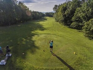 Enjoy a round of golf amidst lush greenery and well-manicured fairways.