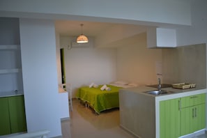 Apartment, 1 Bedroom, Terrace, Garden View | 1 bedroom, iron/ironing board, bed sheets