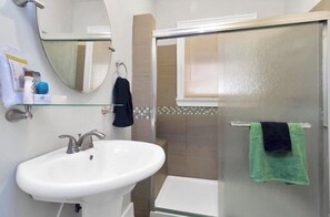 Shower, towels, soap, toilet paper