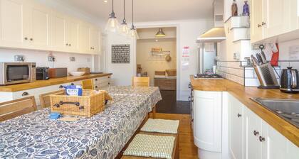Comfortable 7-bedroom house with estuary views and parking