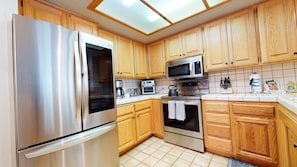 Condo, 2 Bedrooms | Private kitchen | Fridge, microwave, oven, dishwasher