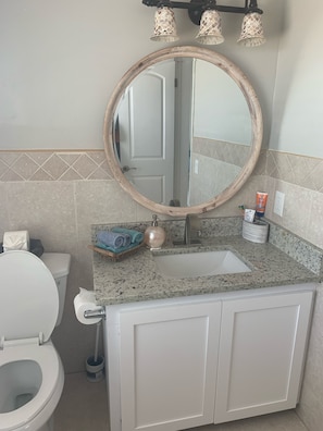 Combined shower/tub, hair dryer, towels, soap
