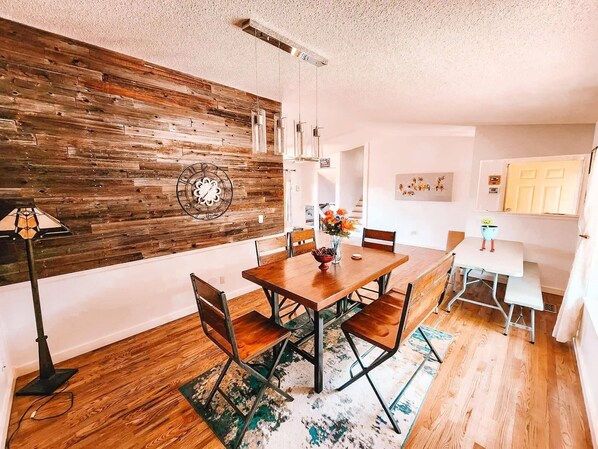 Enjoy meals in this dining area with a round table and comfortable chairs.