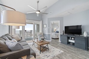 TV, books - "Waters Edge 433-A" - Oceanfront Condo w/ Community Pool, 2 Bedrooms / 2 Bathrooms (Holden Beach)