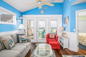 TV, fireplace - "Waters Edge 427-A" - Oceanfront Condo w/ Community Pool, 2 Bedrooms / 2 Bathrooms (Holden Beach)